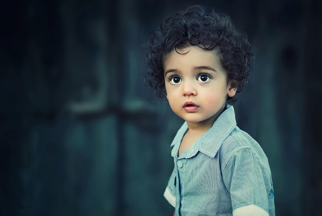 Toddle Wearing Gray Button Collared Shirt With Curly Hair