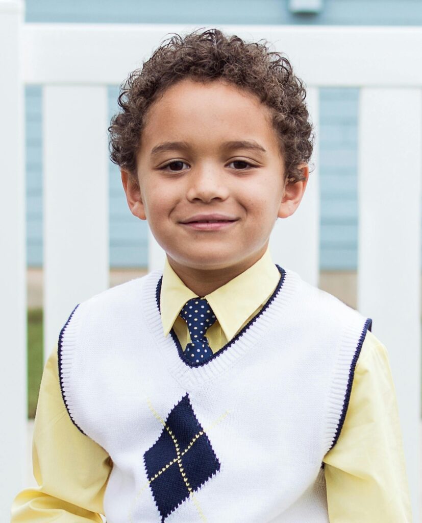 Boy in White and Black Top